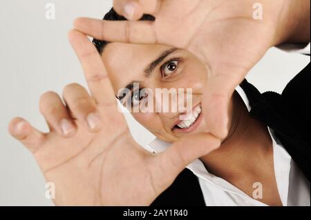 Young man making shape with his hands Stock Photo