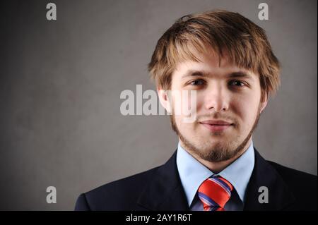 Handsome young man in a suit and west Stock Photo