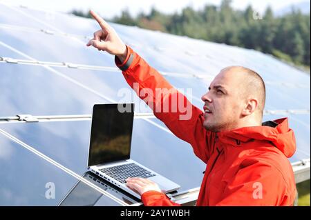 Male engineer using laptop Stock Photo