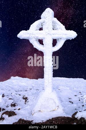 Frozen summit cross on top of a mountain in the Dolomite Alps Stock ...