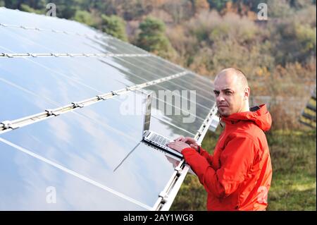 Male engineer using laptop Stock Photo