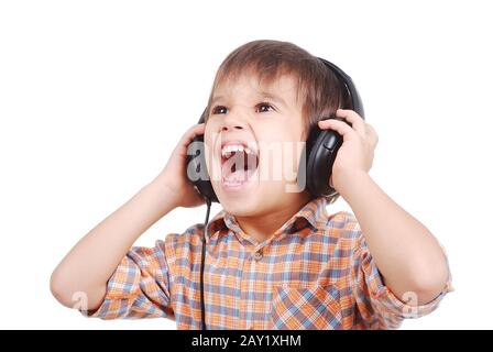 Little nice boy listening to music with peaceful expression on face Stock Photo