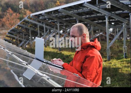 Male engineer using laptop Stock Photo