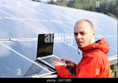 Male engineer using laptop Stock Photo