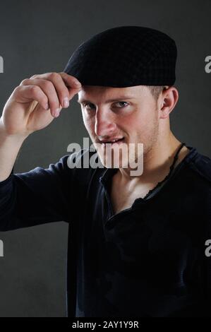 Portrait of a young man grey background. Love and rose Stock Photo - Alamy