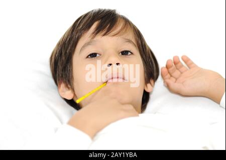 Sick little boy with thermometer Stock Photo