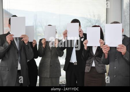 group of business people holding blank signs Stock Photo