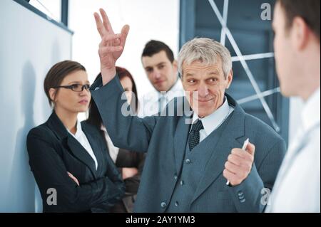 Business team discussing a project with boss Stock Photo