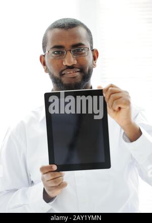 African man holding tablet ready for your message Stock Photo