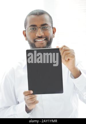 African man holding tablet ready for your message Stock Photo