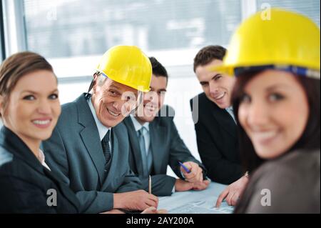 Business people in conference room talking about future plans Stock Photo