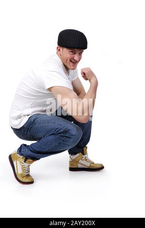 Young happy man crouching Stock Photo