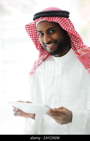 Arabic executive person using tablet at office Stock Photo