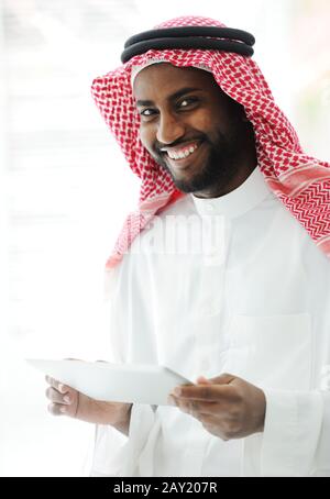 Arabic executive person using tablet at office Stock Photo