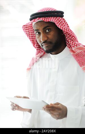 Arabic executive person using tablet at office Stock Photo
