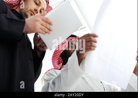Business people planning work in office working on tablet computer Stock Photo