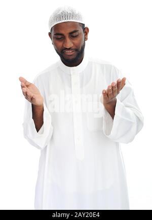 Black arabic man praying Stock Photo