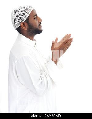 Black arabic man praying Stock Photo