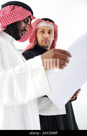 Business people planning work in office working on tablet computer Stock Photo