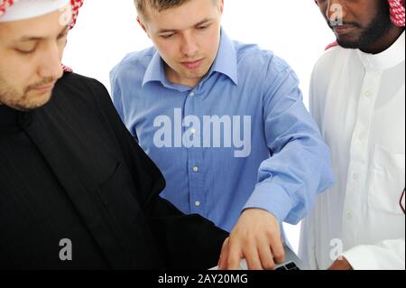 A business team of three planning work in office Stock Photo
