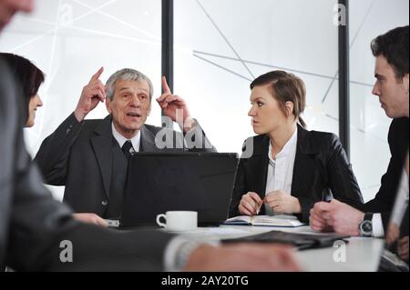Group of business people having a discussion in office Stock Photo