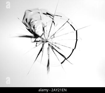 Cracks on broken glass from stone impact Abstraction of broken windshield. Stock Photo