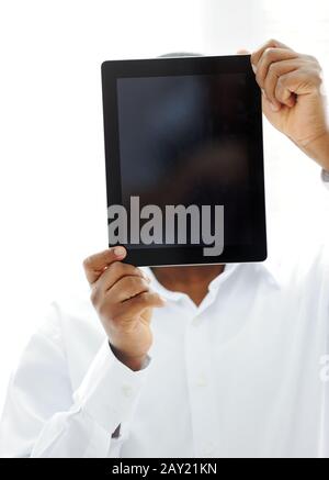 African man holding tablet ready for your message Stock Photo