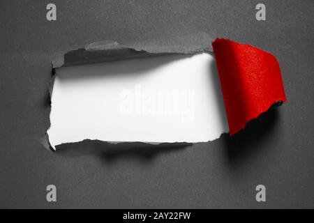 copyspace, torn red paper with white and black background with hard shadows for text insertion Stock Photo