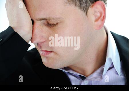 Man suffering from migraine or headache over white Stock Photo