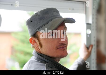 Construction worker with level tool Stock Photo