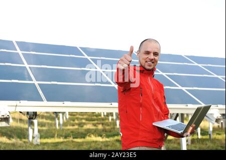 Male engineer using laptop Stock Photo