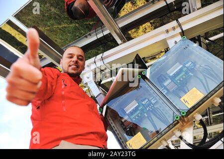 Engineer working with laptop installing  solar panels Stock Photo