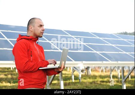 Male engineer using laptop Stock Photo