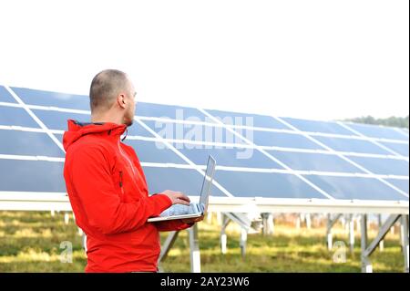Male engineer using laptop Stock Photo