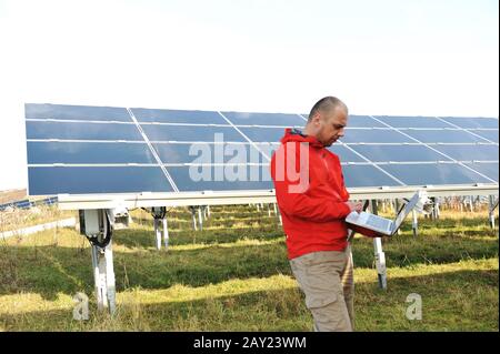Male engineer using laptop Stock Photo