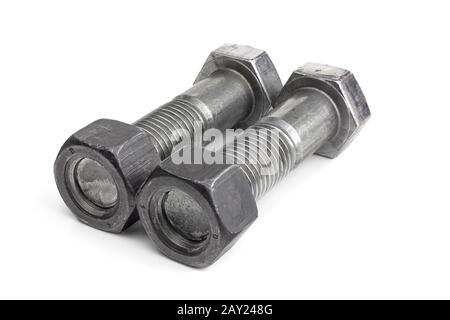 Two industrial screws with nuts lie isolated on white background. Stock Photo