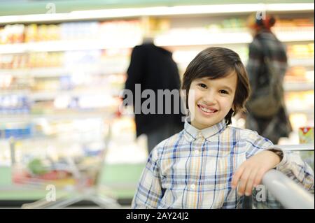 Boy in supermarket Stock Photo