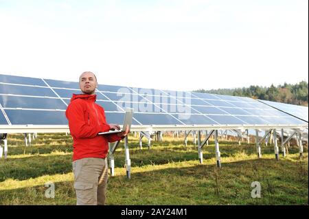 Male engineer using laptop Stock Photo