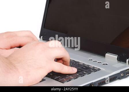 Male hands fast typing on laptop Stock Photo