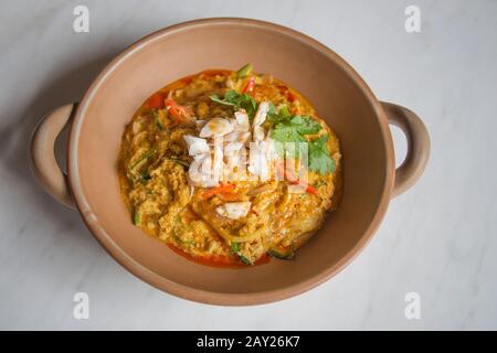 Thai food is  characterized by lightly prepared dishes with strong aromatic components and a spicy edge. This is crab curry stir fried. Stock Photo