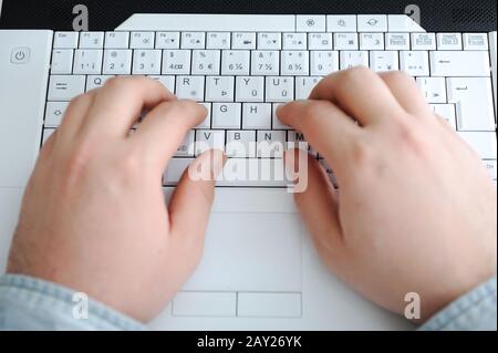 man typing on a computer keyboard Stock Photo