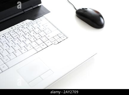 Laptop on white table Stock Photo
