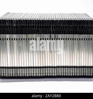 numerous black floppydisks lined up on a white background Stock Photo