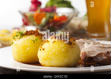 Potato dumplings and Bavarian roast pork Stock Photo