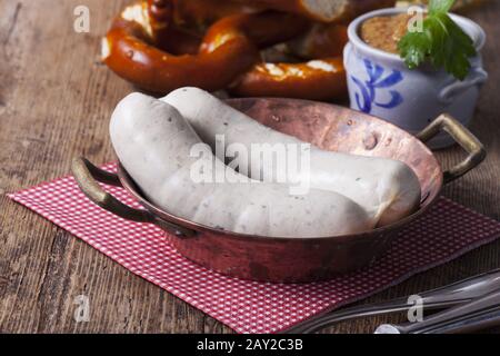 Bavarian veal sausage in a copper crucible Stock Photo