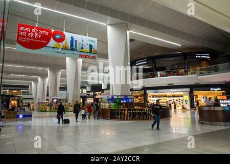 India, New Delhi, transport, Indira Gandhi, International Airport, passengers passing airside Departure Lounge shops Stock Photo