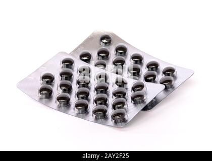 Stack Medication Packages Stack of blister pack contains many black tablets isolated on white ...