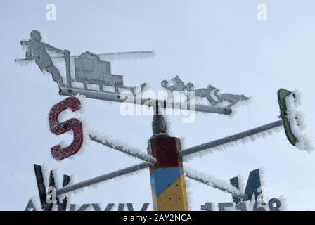 Signpost directions of the compass in the Antarctic. Stock Photo