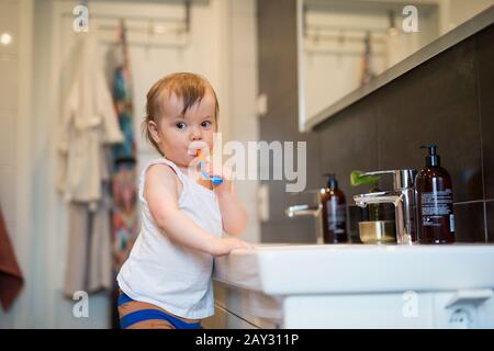 Boy brushing teeth Stock Photo