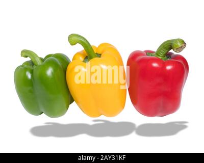 fresh green , red and yellow bell pepper slide isolated on white background with shadow, clipping path included. studio shot Stock Photo